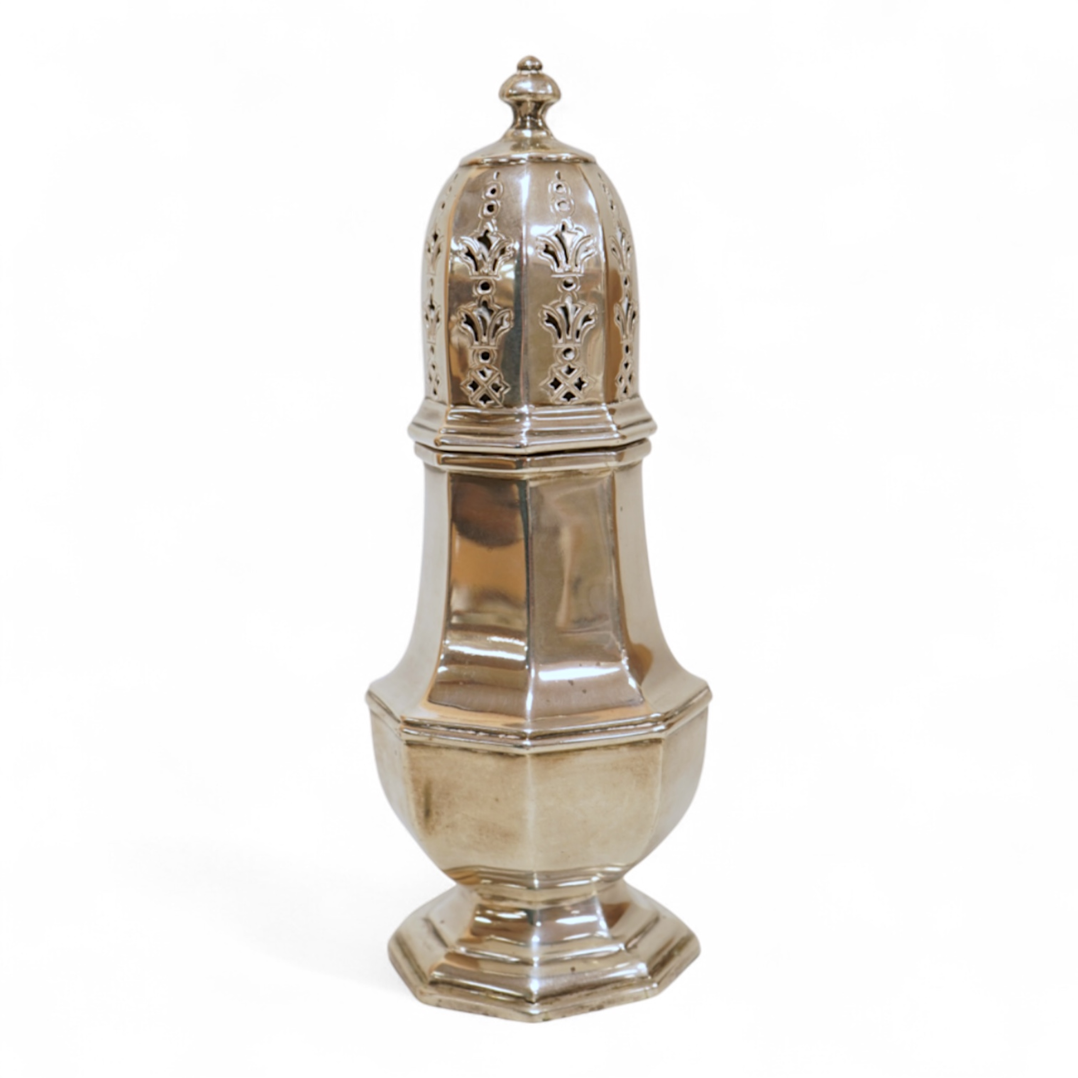A George V silver octagonal silver sugar caster, by Mappin & Webb, Birmingham, 1930, height 16.7cm, 4.4oz.